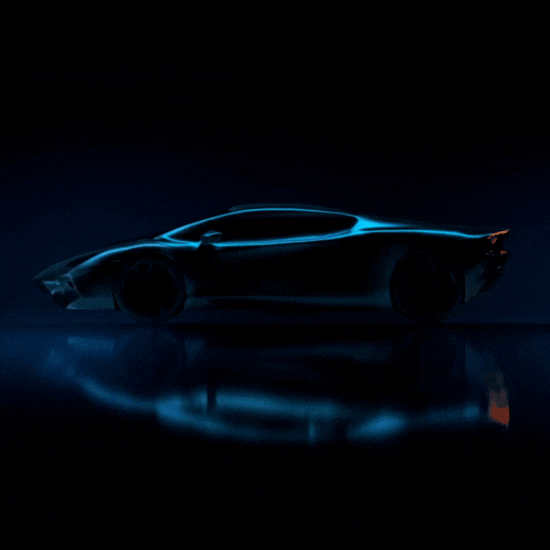 A car is shown in the dark with blue light.