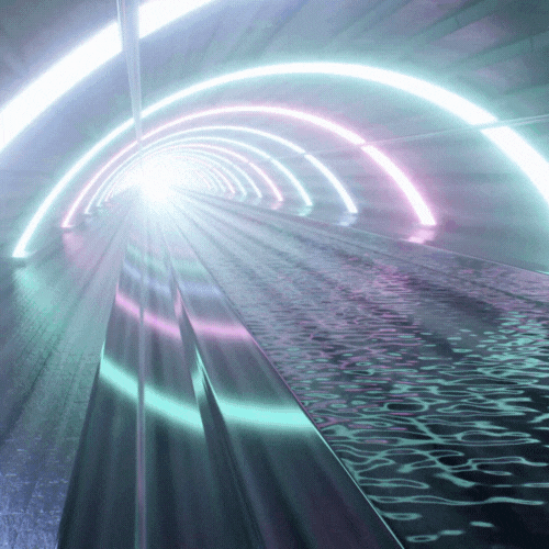 A tunnel with lights and a light beam.