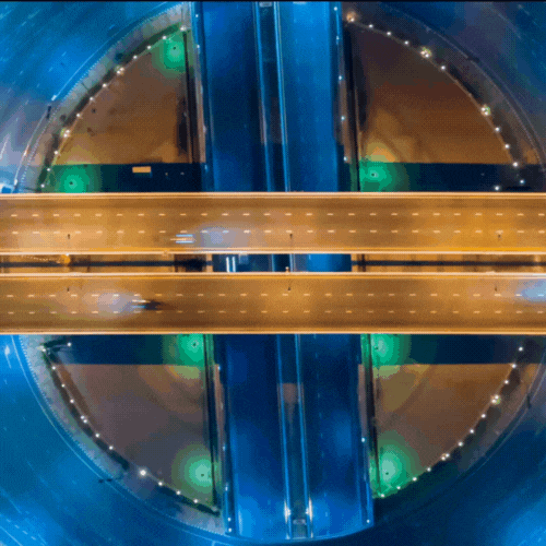 A blue and yellow abstract image of an intersection.